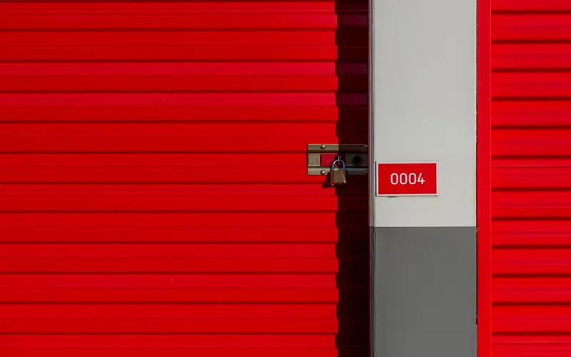 A row of self-storage units with roller doors